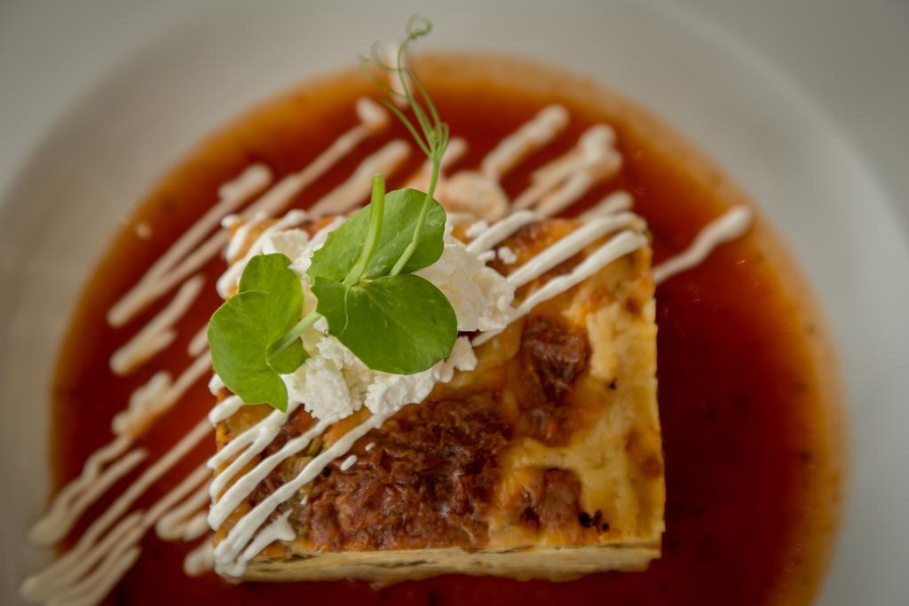 Suites Contempo Mexico City Exterior photo A piece of quiche with a garnish
